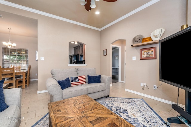 217 Sugarloaf Ave, Abilene, TX 79602 - living room featuring arched walkways, a ceiling fan, ornamental molding, a chandelier, and light tile patterned flooring