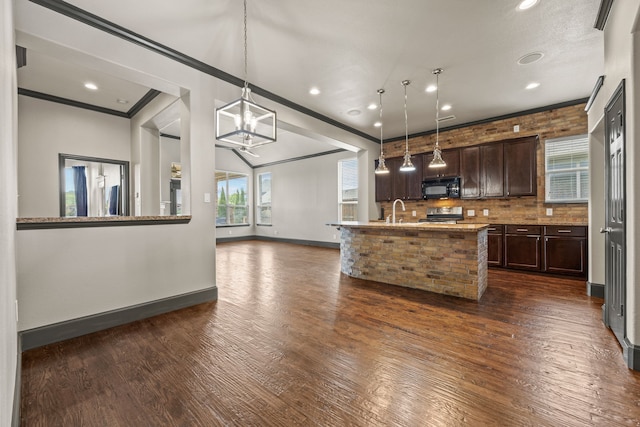 682 Cannon Dr, Fate, TX 75087 - kitchen featuring black microwave, dark brown cabinets, dark wood-style flooring, stainless steel stove, and ornamental molding