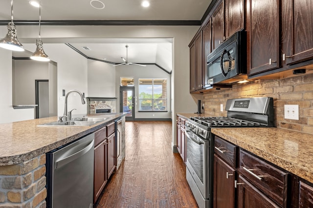 682 Cannon Dr, Fate, TX 75087 - kitchen with stainless steel appliances, a ceiling fan, ornamental molding, backsplash, and dark wood finished floors