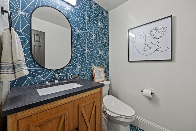 682 Cannon Dr, Fate, TX 75087 - bathroom with vanity and wallpapered walls