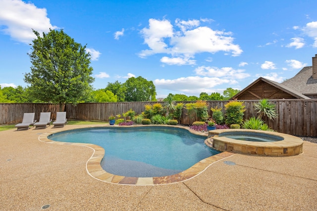 682 Cannon Dr, Fate, TX 75087 - view of pool with a fenced backyard, a pool with connected hot tub, and a patio