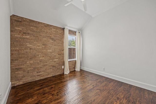 682 Cannon Dr, Fate, TX 75087 - empty room featuring ceiling fan, lofted ceiling, dark wood-type flooring, brick wall, and crown molding