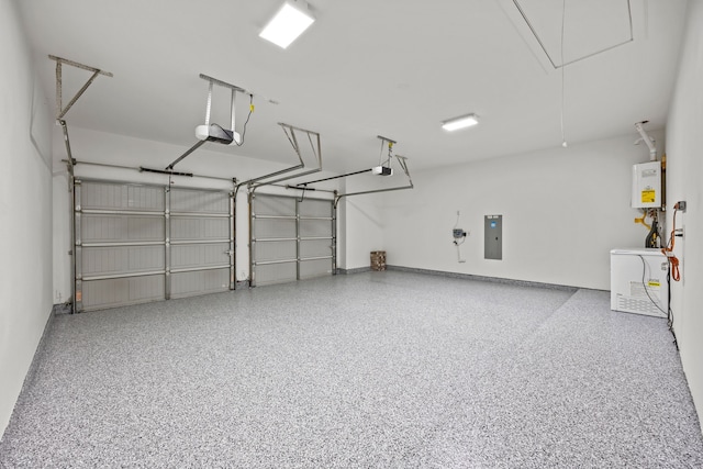 682 Cannon Dr, Fate, TX 75087 - garage featuring electric panel and a garage door opener