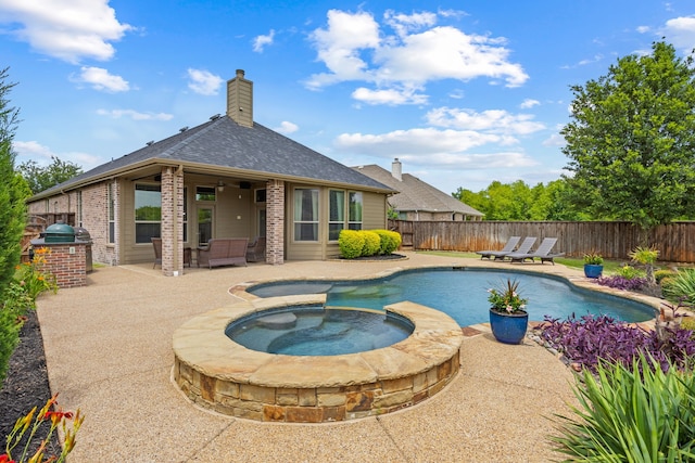 682 Cannon Dr, Fate, TX 75087 - view of swimming pool with a patio, a fenced backyard, a pool with connected hot tub, area for grilling, and a ceiling fan