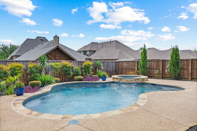 682 Cannon Dr, Fate, TX 75087 - view of swimming pool with a fenced backyard and a pool with connected hot tub