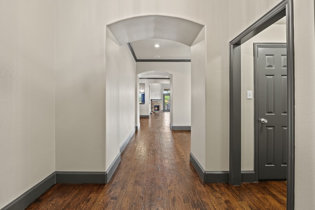 682 Cannon Dr, Fate, TX 75087 - hall with arched walkways, wood finished floors, and ornamental molding