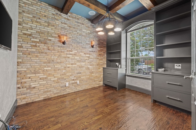 682 Cannon Dr, Fate, TX 75087 - unfurnished office featuring coffered ceiling, brick wall, dark wood-type flooring, a chandelier, and beam ceiling
