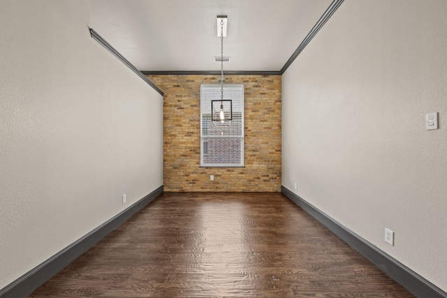 682 Cannon Dr, Fate, TX 75087 - unfurnished dining area featuring wood finished floors and ornamental molding