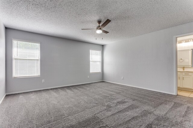 8732 Hunters Trl, Fort Worth, TX 76123 - empty room featuring ceiling fan, carpet floors, and a textured ceiling