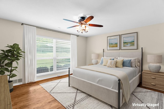 206 S Field St, Prosper, TX 75078 - bedroom featuring wood finished floors and a ceiling fan