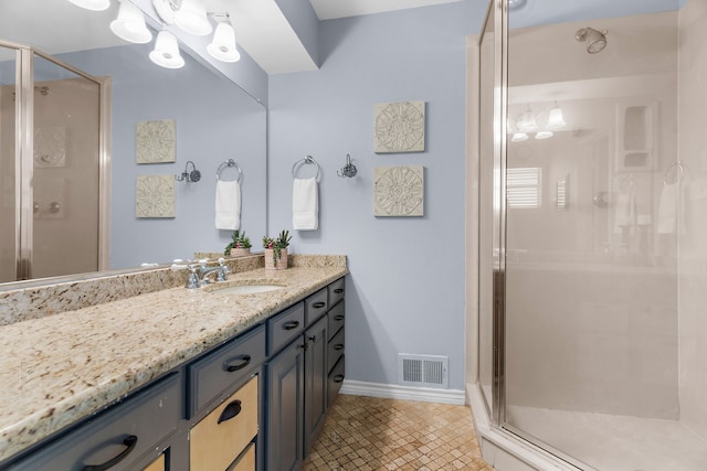 206 S Field St, Prosper, TX 75078 - bathroom with vanity, a shower stall, and tile patterned flooring