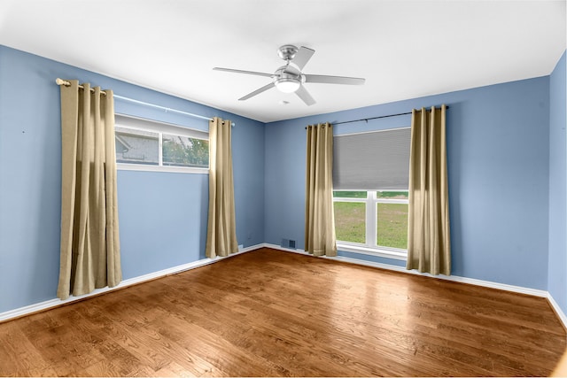 206 S Field St, Prosper, TX 75078 - spare room featuring wood finished floors and a ceiling fan