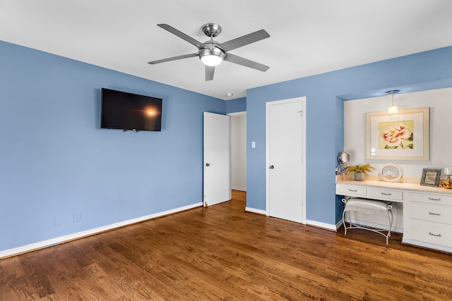 206 S Field St, Prosper, TX 75078 - bedroom featuring wood finished floors, built in study area, and ceiling fan