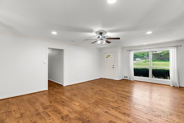 206 S Field St, Prosper, TX 75078 - unfurnished room featuring a ceiling fan, wood finished floors, recessed lighting, and ornamental molding