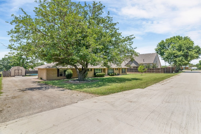 206 S Field St, Prosper, TX 75078 - view of front of house featuring a storage shed and driveway