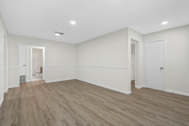 1828 Tracey Cir, Irving, TX 75060 - spare room with light wood finished floors and recessed lighting