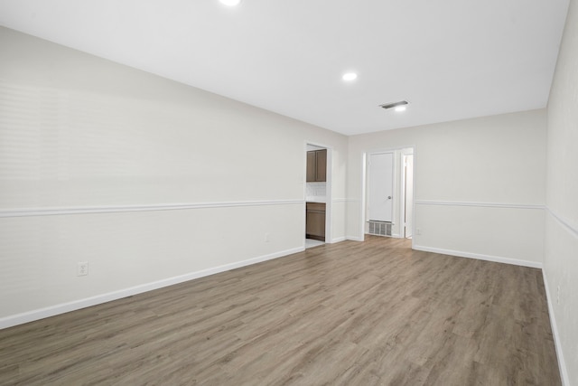 1828 Tracey Cir, Irving, TX 75060 - unfurnished room with light wood finished floors and recessed lighting