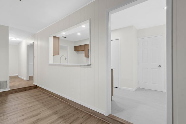 1828 Tracey Cir, Irving, TX 75060 - hallway featuring baseboards and light wood-type flooring