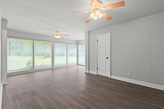 119 Locust Ct, Oak Leaf, TX 75154 - empty room with ceiling fan, healthy amount of natural light, dark wood-type flooring, and a textured ceiling