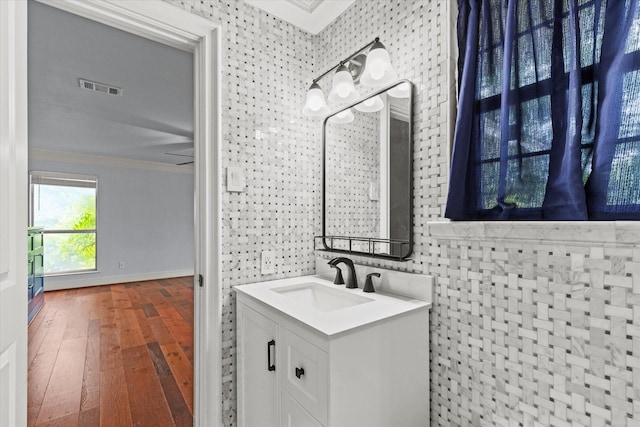 119 Locust Ct, Oak Leaf, TX 75154 - bathroom featuring ornamental molding, hardwood / wood-style floors, and vanity
