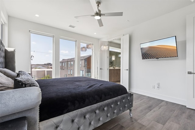 4726 Manett St Unit 101, Dallas, TX 75204 - bedroom with wood finished floors, connected bathroom, recessed lighting, and ceiling fan
