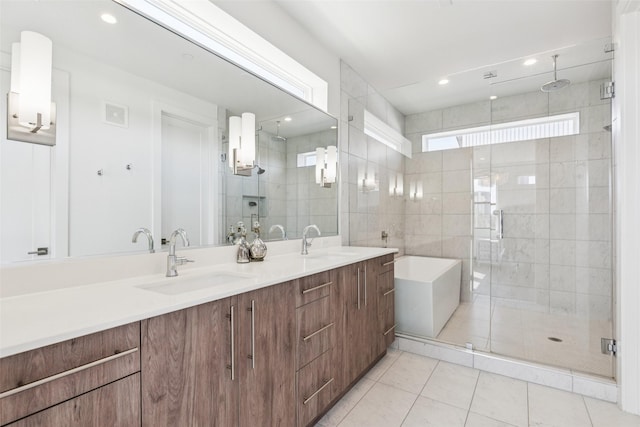 4726 Manett St Unit 101, Dallas, TX 75204 - bathroom with a stall shower, double vanity, tile patterned flooring, a tub, and recessed lighting
