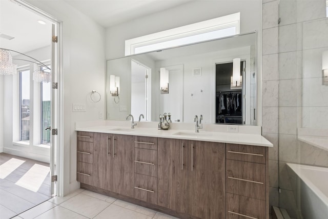 4726 Manett St Unit 101, Dallas, TX 75204 - full bathroom with double vanity, tile patterned floors, and a tub to relax in