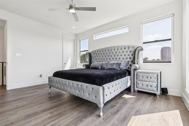 4726 Manett St Unit 101, Dallas, TX 75204 - bedroom with wood finished floors, ceiling fan, and recessed lighting