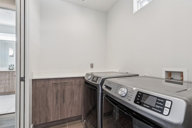 4726 Manett St Unit 101, Dallas, TX 75204 - laundry room with cabinet space and washing machine and clothes dryer