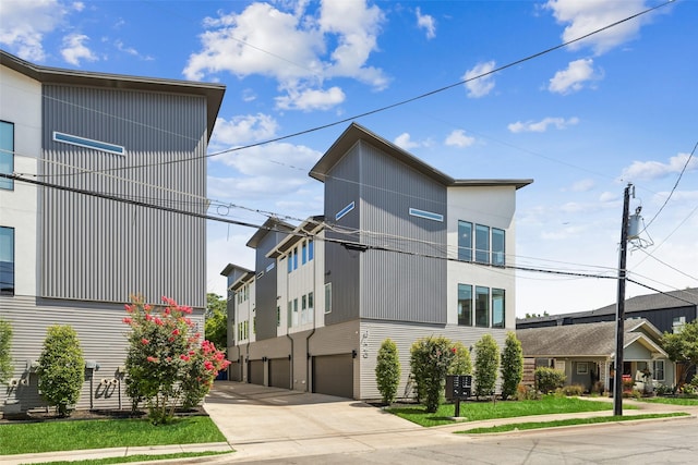4726 Manett St Unit 101, Dallas, TX 75204 - view of front of house featuring an attached garage and driveway