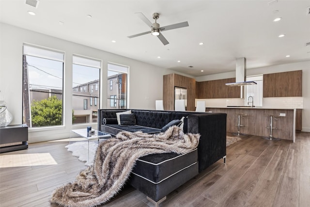 4726 Manett St Unit 101, Dallas, TX 75204 - living area featuring light wood finished floors, recessed lighting, and ceiling fan