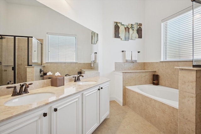 5704 Ridgeson Dr, Mckinney, TX 75071 - full bath with a shower stall, a garden tub, double vanity, tile patterned floors, and lofted ceiling