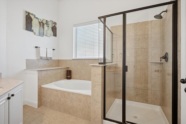 5704 Ridgeson Dr, Mckinney, TX 75071 - full bath featuring a garden tub, a shower stall, vanity, and tile patterned flooring