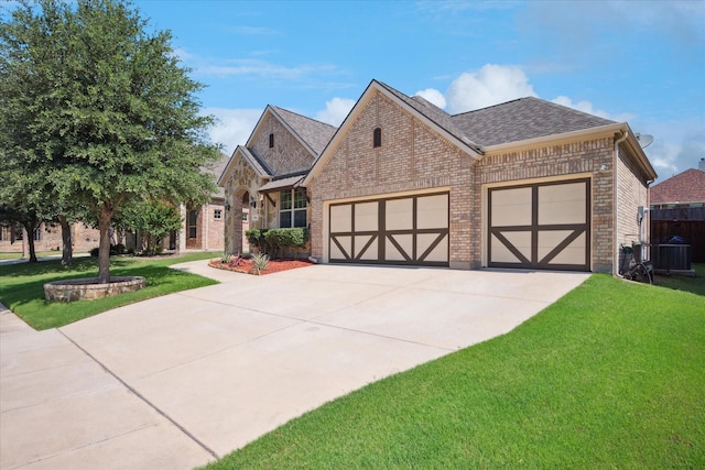 5704 Ridgeson Dr, Mckinney, TX 75071 - view of front of property with brick siding, a garage, a front lawn, concrete driveway, and roof with shingles