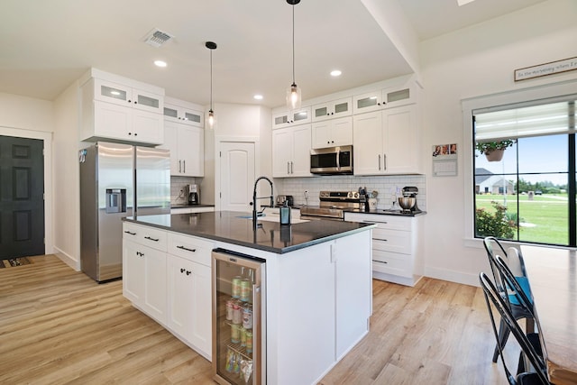176 Private Road 33082, Sumner, TX 75486 - kitchen featuring stainless steel appliances, beverage cooler, dark countertops, backsplash, and recessed lighting