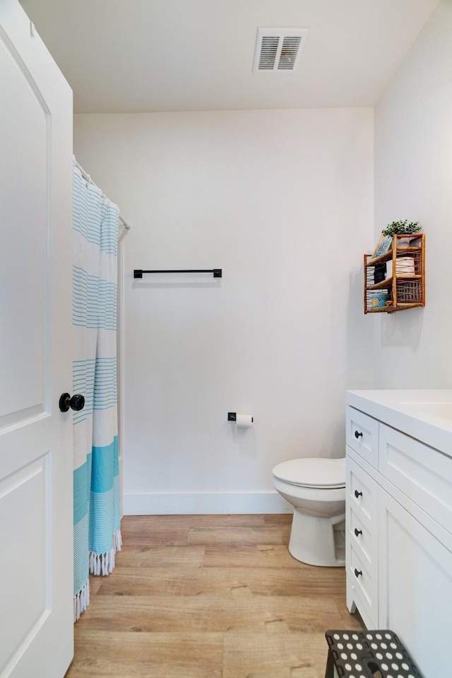 176 Private Road 33082, Sumner, TX 75486 - full bath with wood finished floors, vanity, and a shower with shower curtain