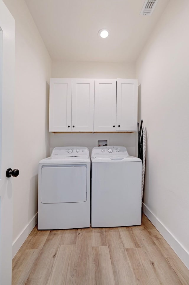 176 Private Road 33082, Sumner, TX 75486 - laundry room featuring cabinet space, washer and dryer, light wood finished floors, and recessed lighting