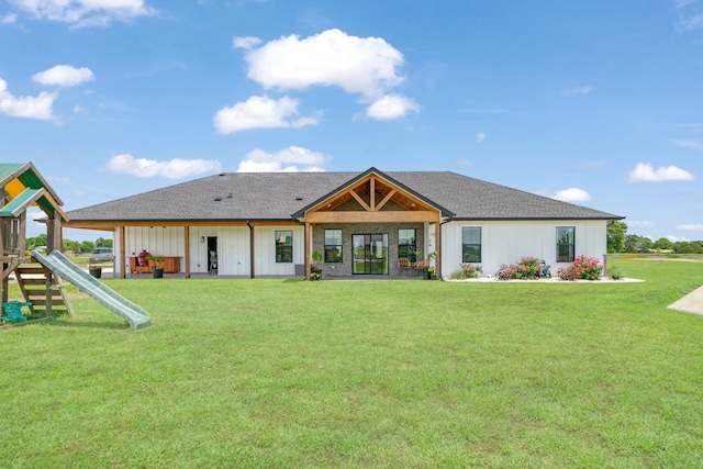 176 Private Road 33082, Sumner, TX 75486 - rear view of property with a playground, a yard, board and batten siding, and roof with shingles