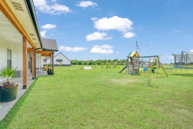 176 Private Road 33082, Sumner, TX 75486 - view of grassy yard with a trampoline and a playground
