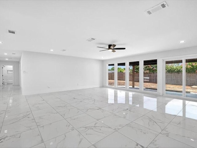 6320 Lavano Dr, Edgecliff Village, TX 76134 - empty room with healthy amount of natural light, light marble finish floors, and recessed lighting