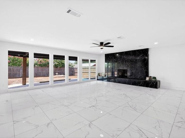 6320 Lavano Dr, Edgecliff Village, TX 76134 - unfurnished living room with marble finish floors, a premium fireplace, ceiling fan, and recessed lighting