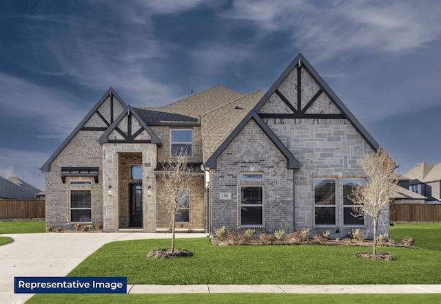 329 Aeronca, Fate, TX 75087 - tudor-style house featuring brick siding and roof with shingles