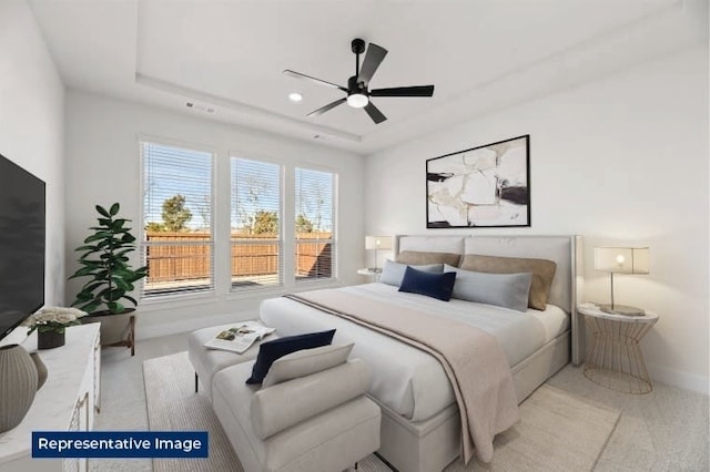 329 Aeronca, Fate, TX 75087 - carpeted bedroom with a tray ceiling and ceiling fan