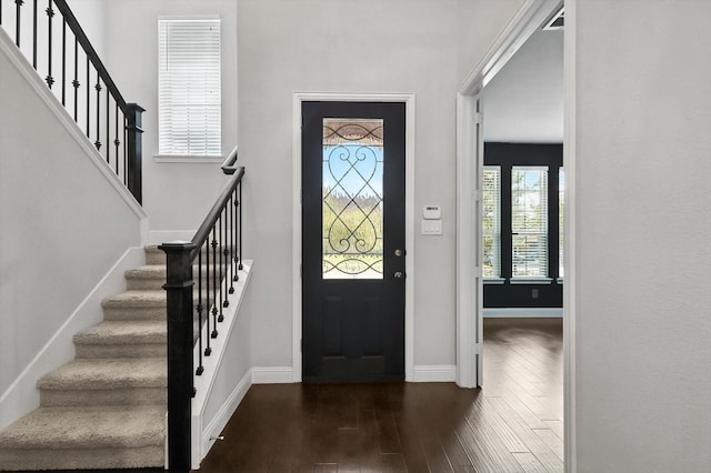9920 Pikes Peak Pl, Little Elm, TX 75068 - entrance foyer with dark wood-style flooring and stairway