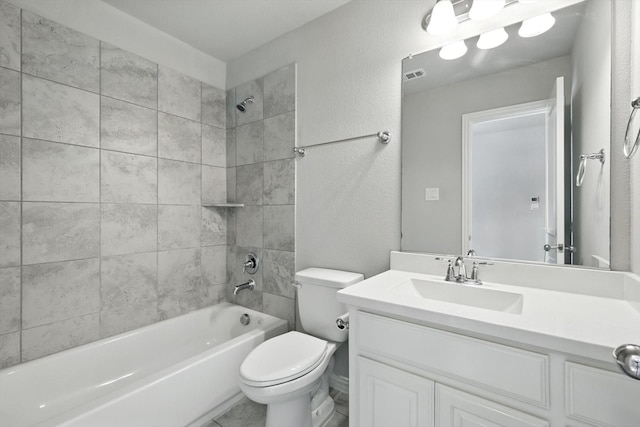 9920 Pikes Peak Pl, Little Elm, TX 75068 - bathroom featuring vanity, shower / bathtub combination, and a textured wall