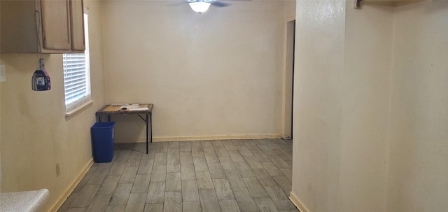 605 N Davis Dr, Arlington, TX 76012 - unfurnished dining area featuring wood finished floors and ceiling fan