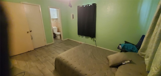 605 N Davis Dr, Arlington, TX 76012 - bathroom with toilet and wood finished floors