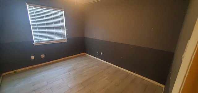 605 N Davis Dr, Arlington, TX 76012 - unfurnished room with wood finished floors and baseboards