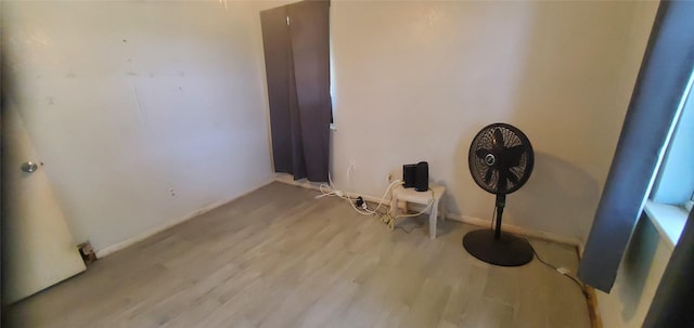 605 N Davis Dr, Arlington, TX 76012 - misc room featuring wood finished floors and baseboards