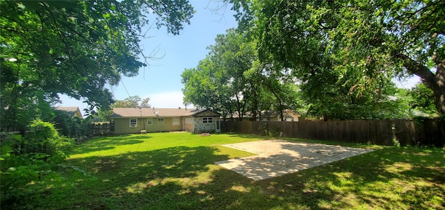 605 N Davis Dr, Arlington, TX 76012 - fenced backyard with a patio area